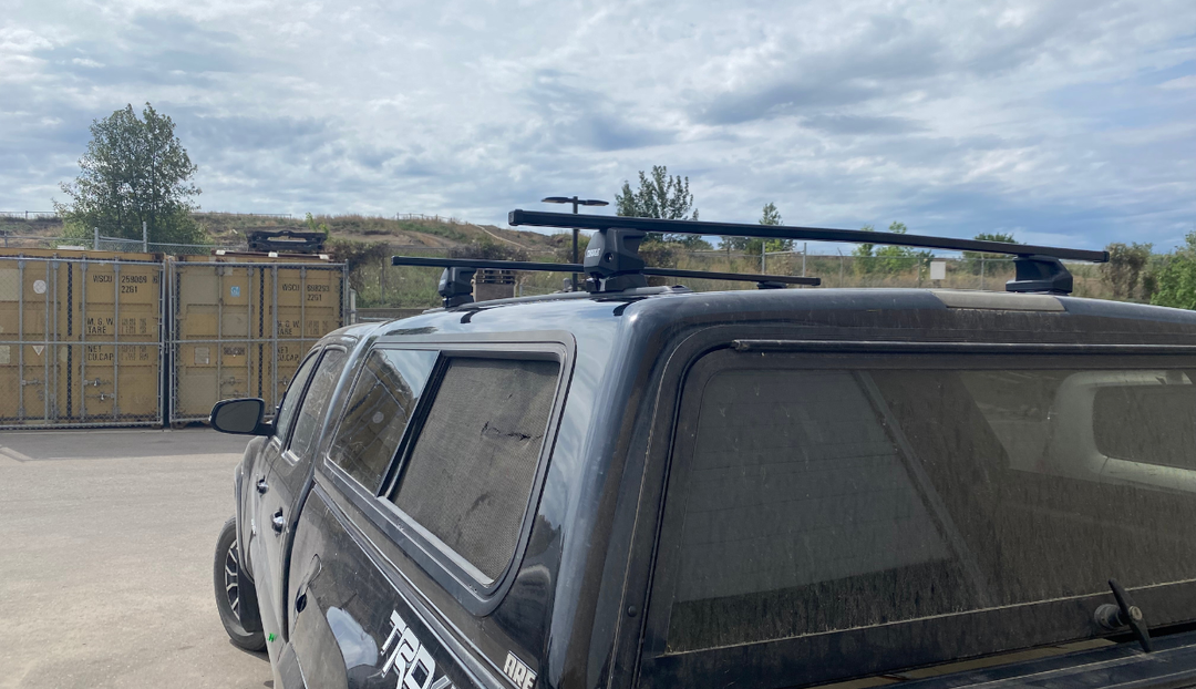 Thule Track-Mounted Roof Rack Installation on a Toyota Tacoma with Topper