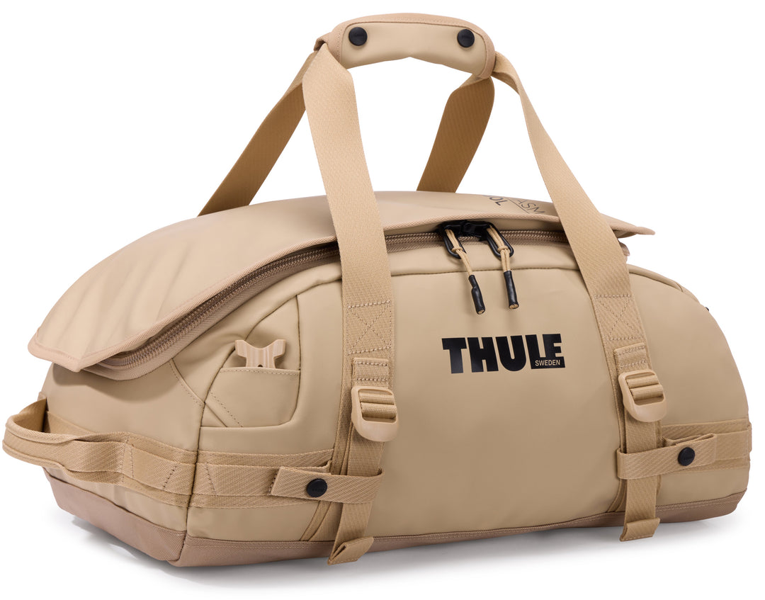 Beige duffel bag with Thule logo on a white background