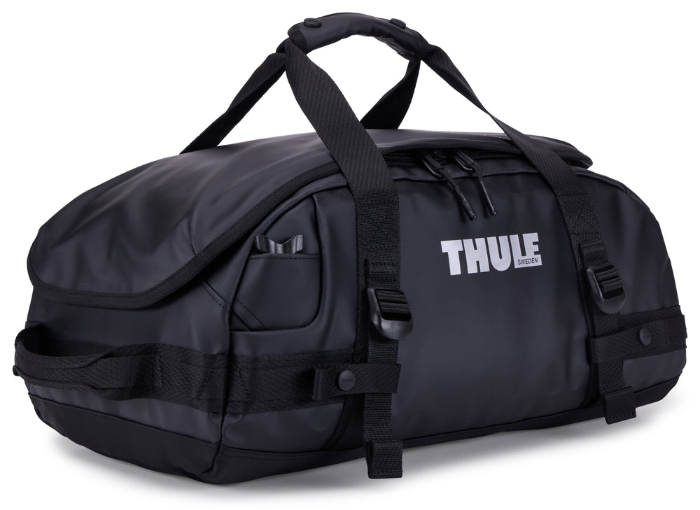 Black Thule duffel bag on a white background